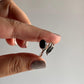 Sophisticated black onyx feather ring in sterling silver with adjustable band.
