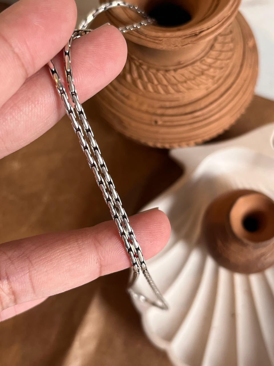 Antique patterned sterling silver chain with detailed craftsmanship.