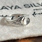 Close-up of clear quartz round silver ring with bohemian design