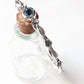 Nature-inspired sterling silver bangle with blue topaz