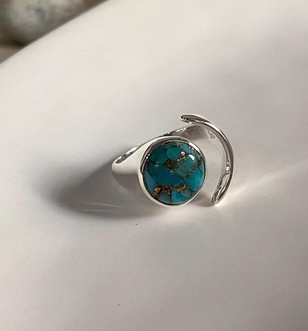 Boho-style copper turquoise moon stone set in an adjustable silver ring