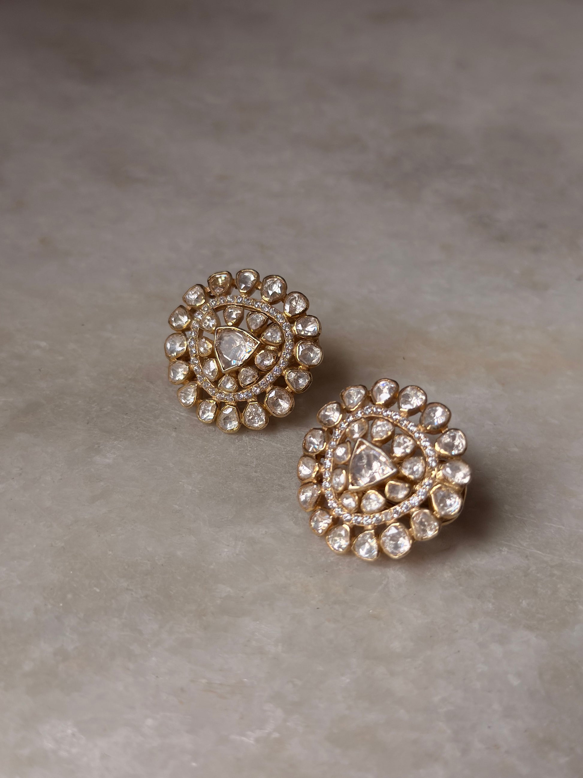 925 Sterling Silver Gold Plated Antique Moissanite Polki Round Studs Earrings on marble surface.