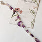 Celestial-themed silver bracelet with amethyst moon charm  