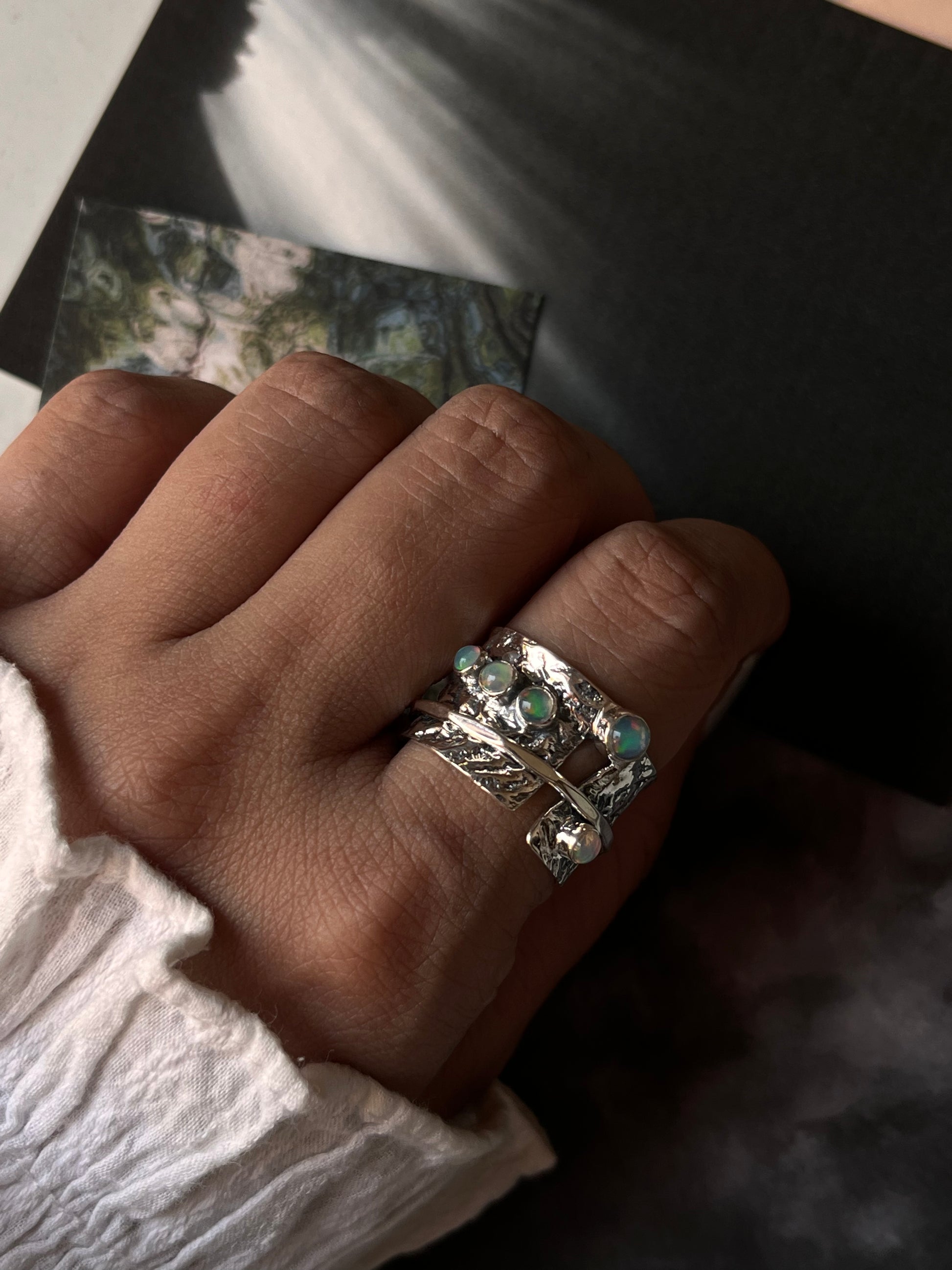 Ethiopian opal spinner ring in 925 sterling silver with rustic wrap