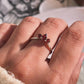 Sophisticated silver ring with garnet 3-stone pear and round cuts
