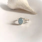 Classic silver ring featuring a natural oval-cut aquamarine gemstone.