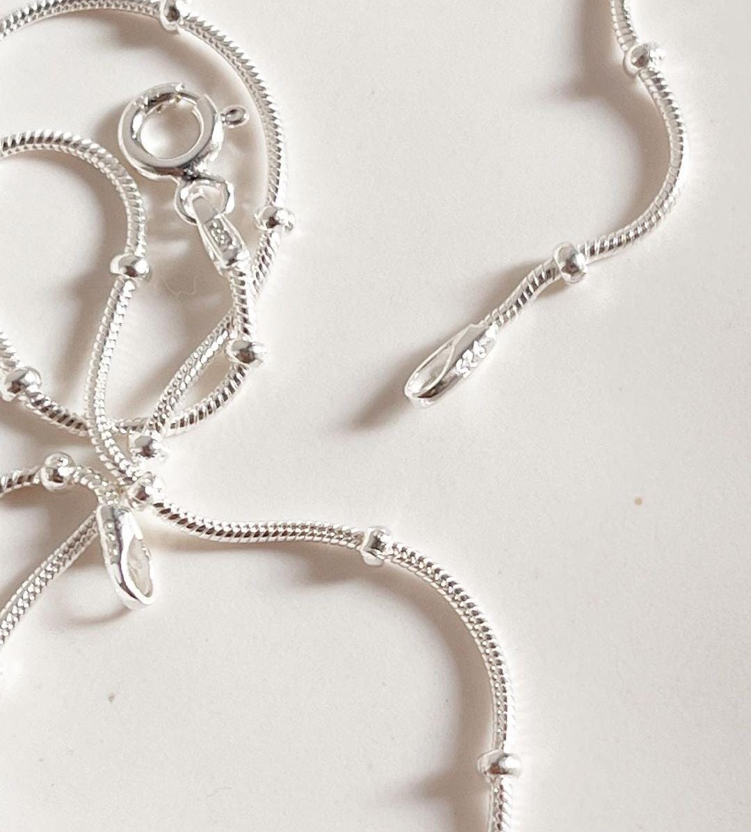 Delicate dot-adorned snake silver chain necklace