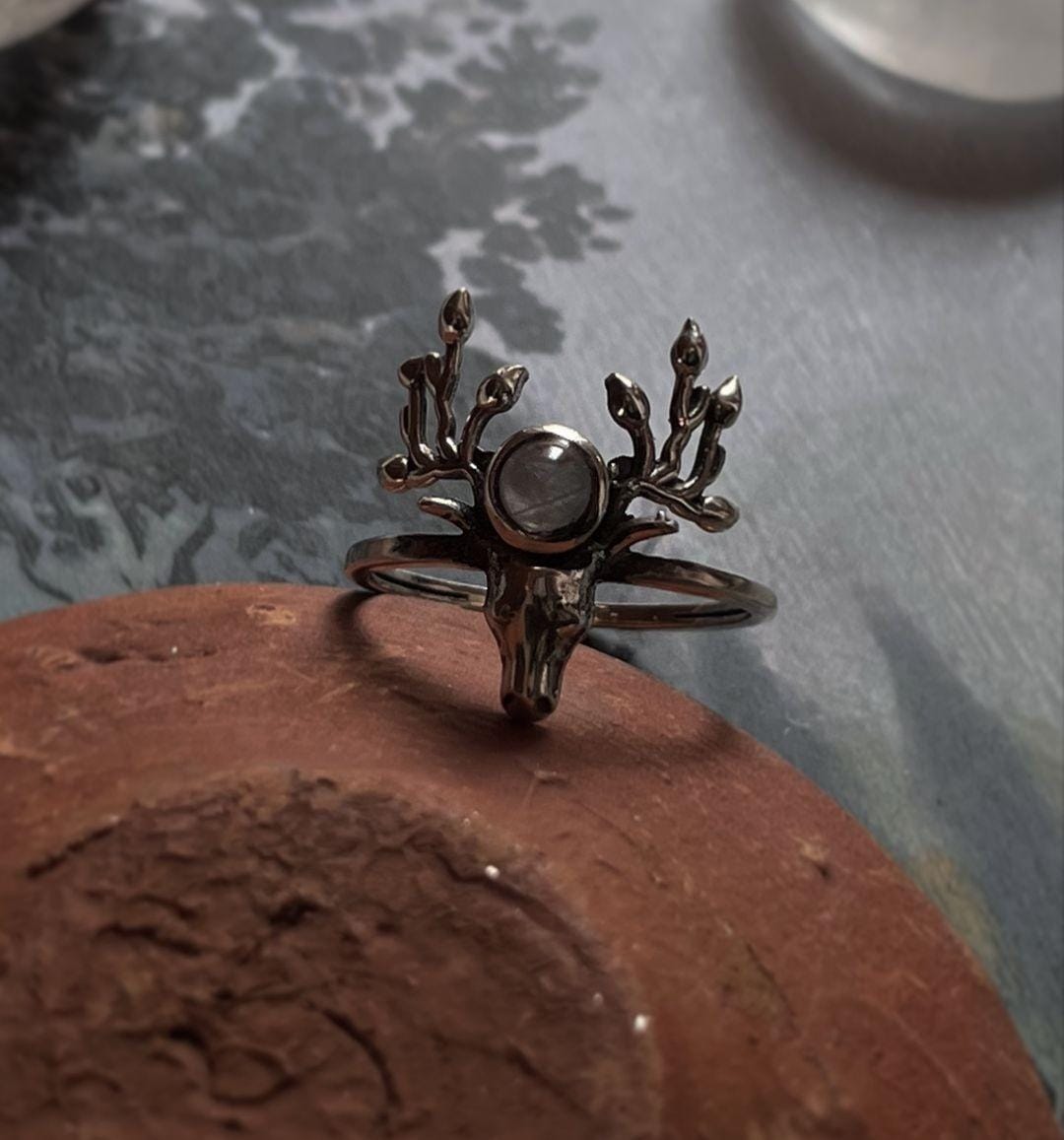 Handcrafted silver ring with antler detailing and moonstone accent.