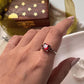 Vintage-inspired silver ring with a square garnet centerpiece
