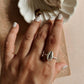 Simple and elegant silver ring with a unique cowrie seashell