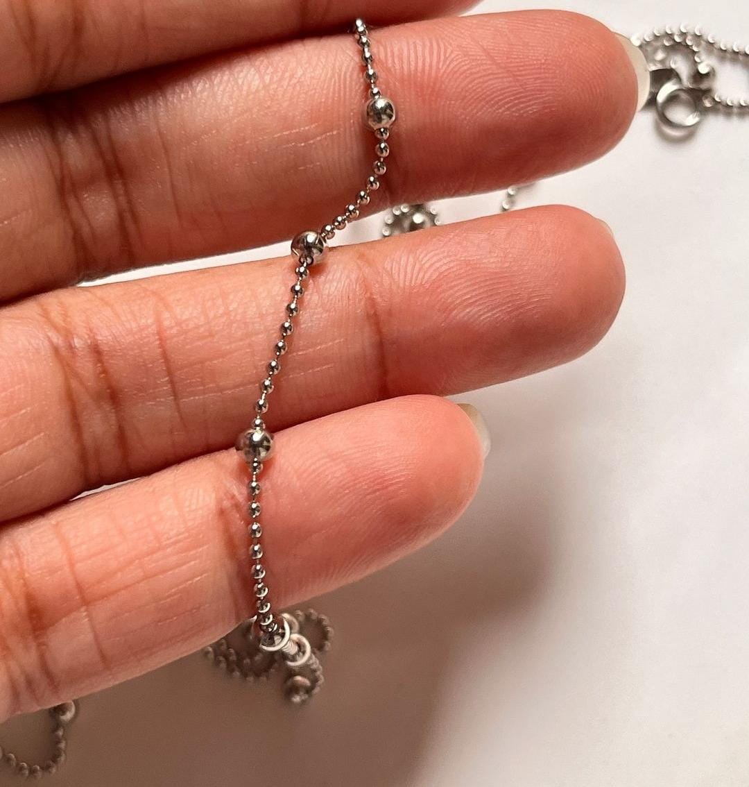 Elegant silver satellite chain featuring dot embellishments