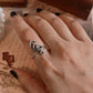 Handmade silver ring featuring spiral motif design