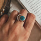 Elegant adjustable silver ring featuring copper and turquoise moon stone