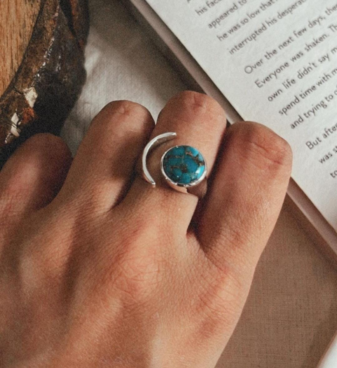 Elegant adjustable silver ring featuring copper and turquoise moon stone