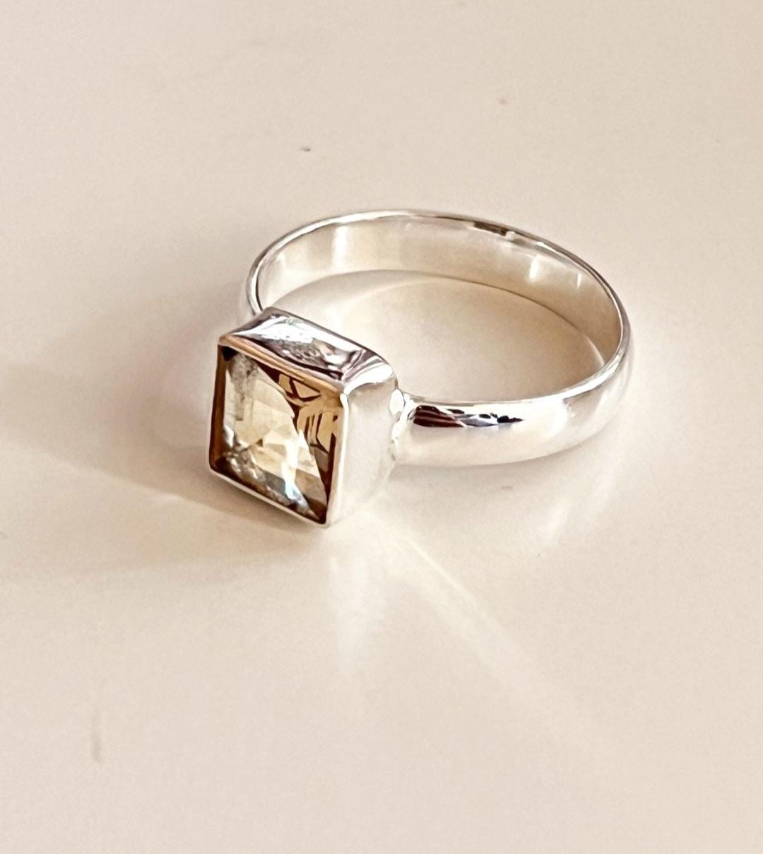 Stylish silver ring featuring a square cut citrine stone