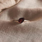 Simple and elegant pear cut garnet solitaire ring in silver