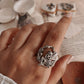 Whimsical fairy in forest silver ring featuring intricate detailing