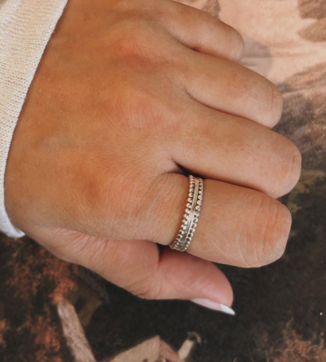 Sleek double rawa silver band ring with elegant, textured design