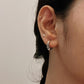 Timeless antique silver hoop earrings with detailed pattern.
