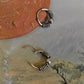 Elegant antique silver hoop earrings with intricate design.
