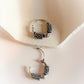 Vintage-style silver hoops with a unique antique design.