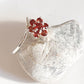 Bold garnet flower statement ring in sterling silver
