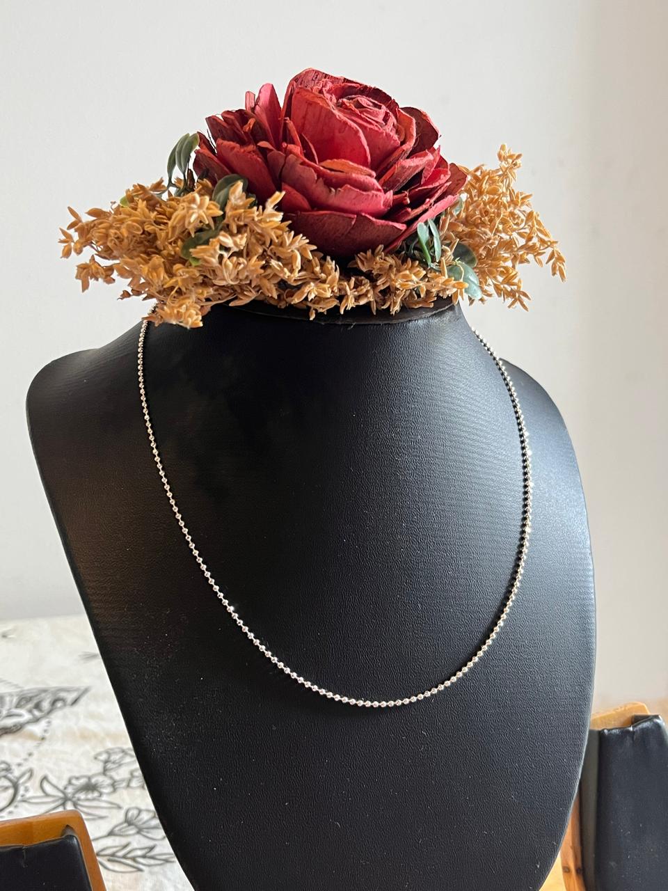 Timeless sterling silver chain featuring dot ball accents