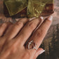 Handcrafted silver ring with a unique antler design.