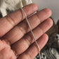 Elegant silver snake chain with sleek, fluid design