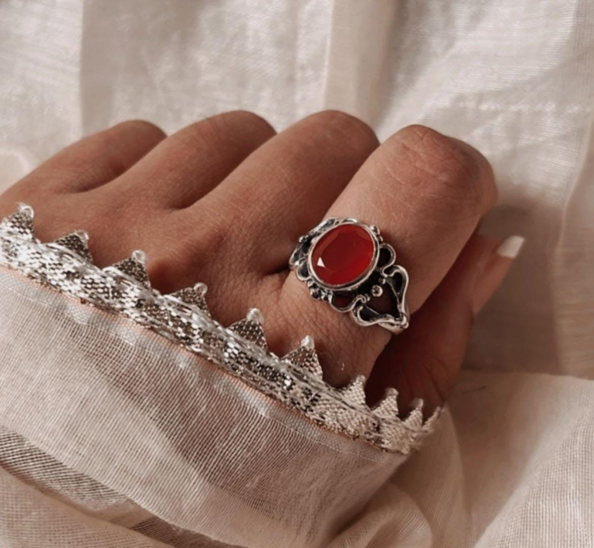 Silver ring featuring a large carnelian gemstone