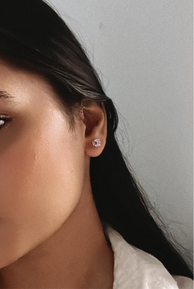 Timeless 4mm round amethyst stud earrings in sterling silver.