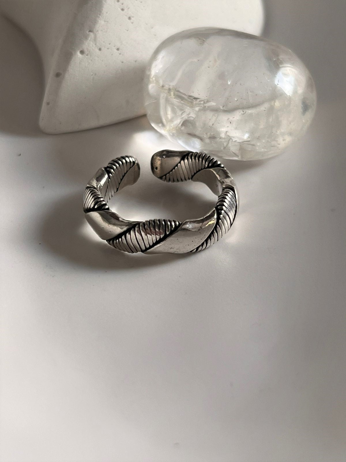 Timeless unisex silver band ring featuring double design elements