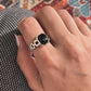 Unique black onyx stone set in a Cuban link band silver ring.