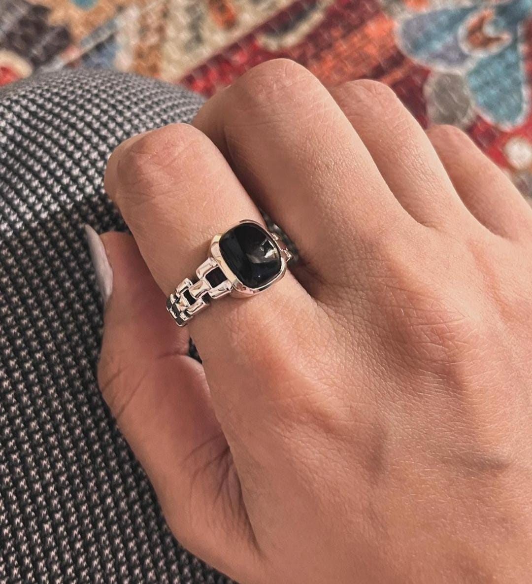 Unique black onyx stone set in a Cuban link band silver ring.