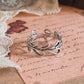 Sleek silver ring with delicate vine and leaf motif