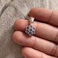 Elegant tanzanite flower pendant in sterling silver
