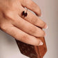 Silver ring with two marquise garnet stones set in a sleek design