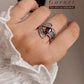 Garnet leaf wrap silver ring with intricate detailing