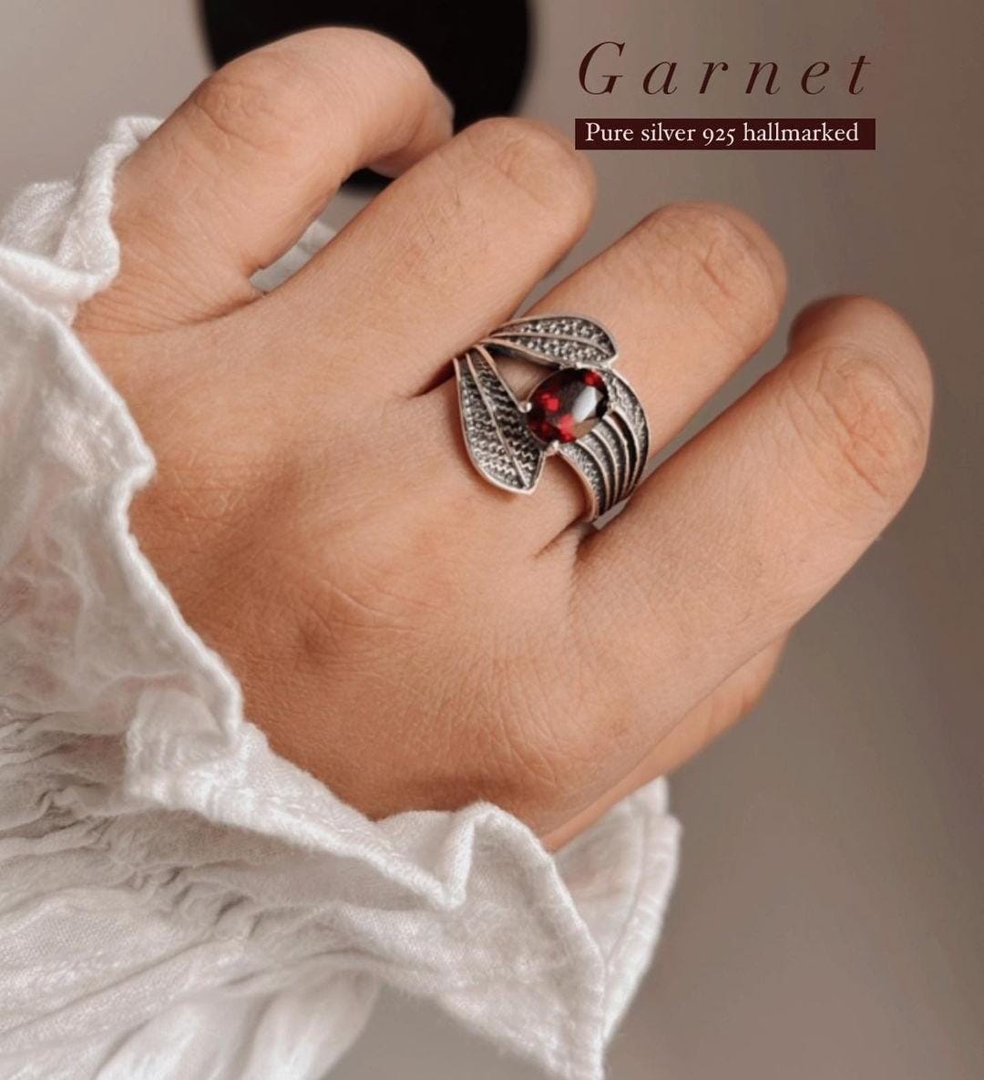 Garnet leaf wrap silver ring with intricate detailing