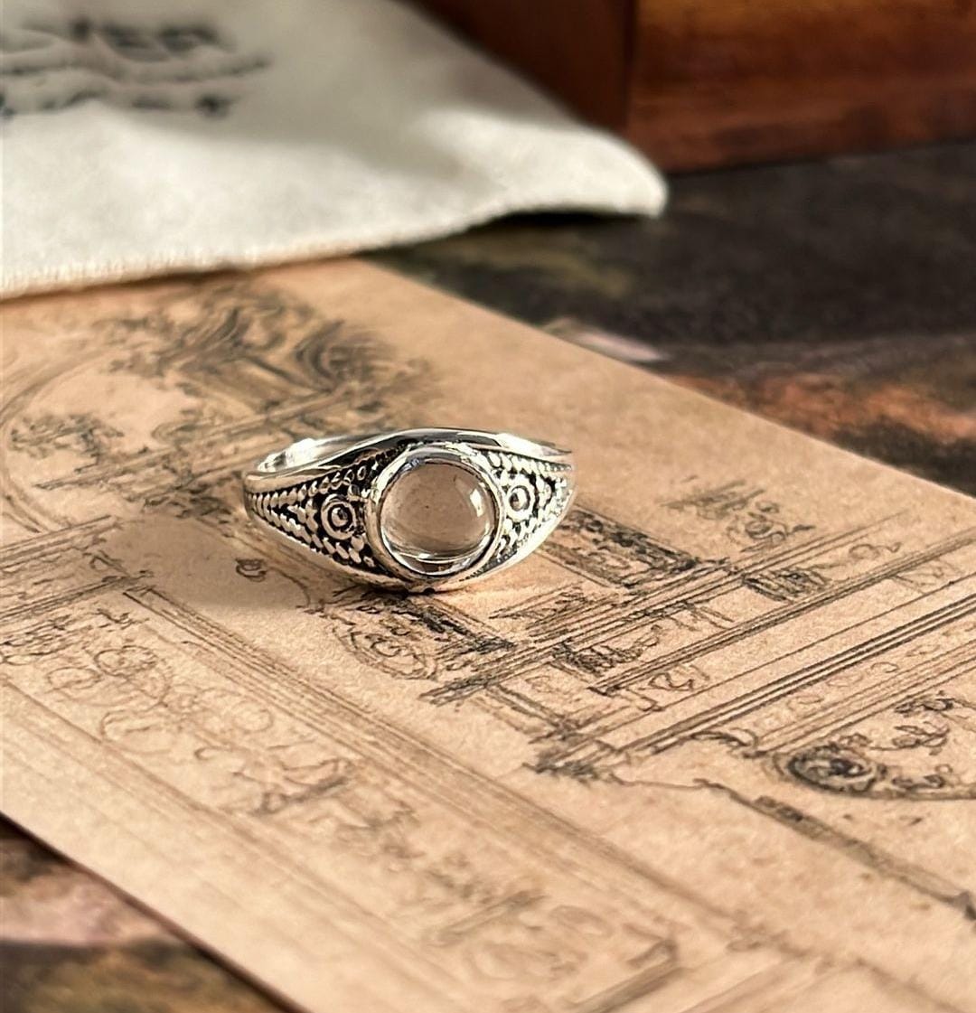 Handcrafted boho silver ring featuring a round clear quartz gemstone
