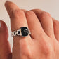 Sophisticated black onyx Cuban link band ring with polished silver finish.