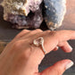 Handcrafted rose quartz oval silver ring with cross band motif