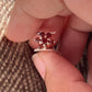 Statement silver ring with a vibrant garnet flower centerpiece