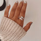 Versatile feather wrap silver ring with an adjustable band for a comfortable fit