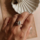Sculpted silver ring with a cowrie seashell for a natural, coastal look