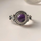 Boho-inspired silver ring featuring a round amethyst gemstone.