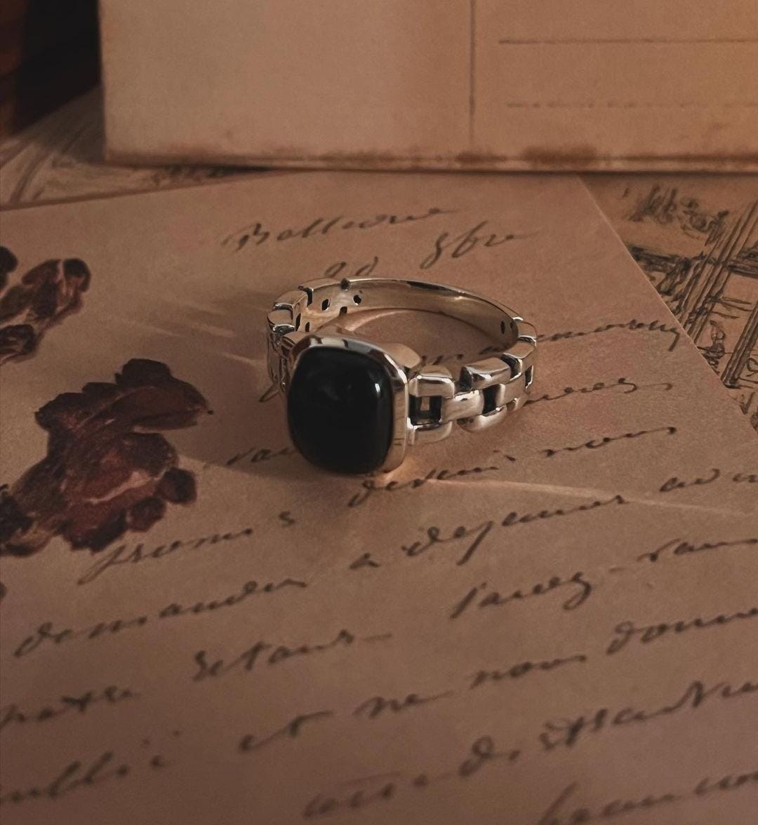 Handcrafted black onyx Cuban link band ring in sterling silver.