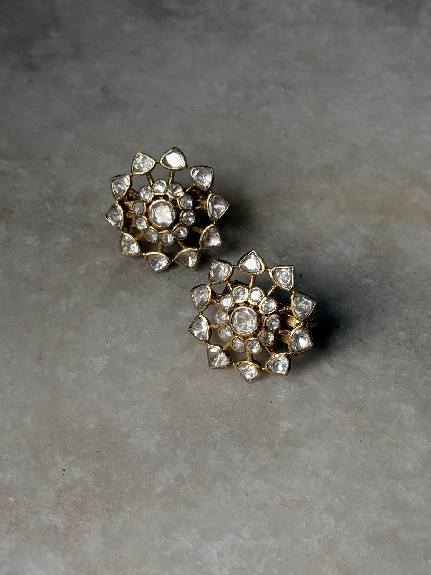 925 Sterling Silver Gold Plated Antique Moissanite Polki Flower Earrings on a grey surface.