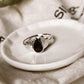 Garnet adorned divine lotus silver ring with intricate details