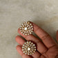 925 Sterling Silver Gold Plated Antique Moissanite Polki Round Studs Earrings held in a hand.